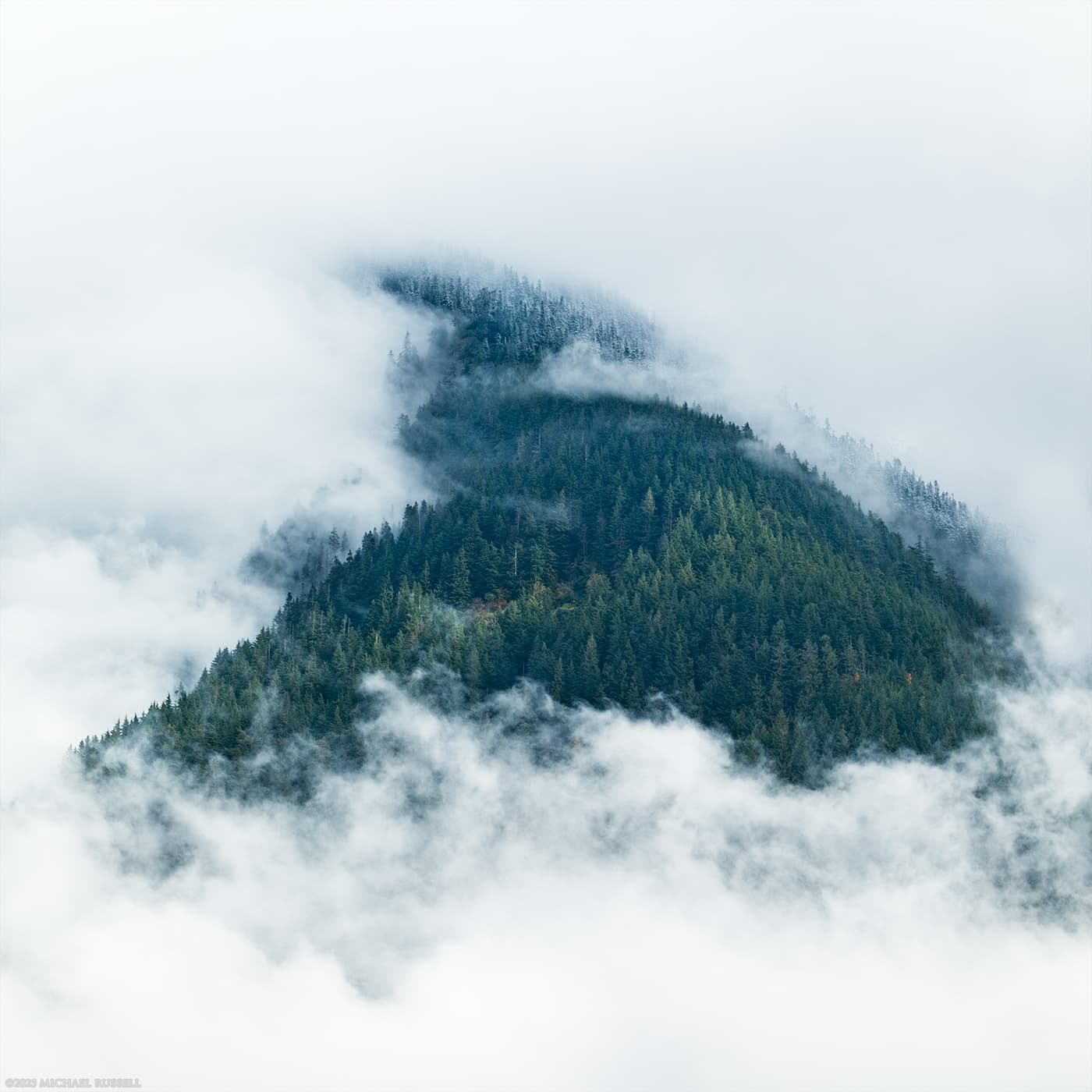 clouds clearing from mount cheam in the fraser valley of chilliwack