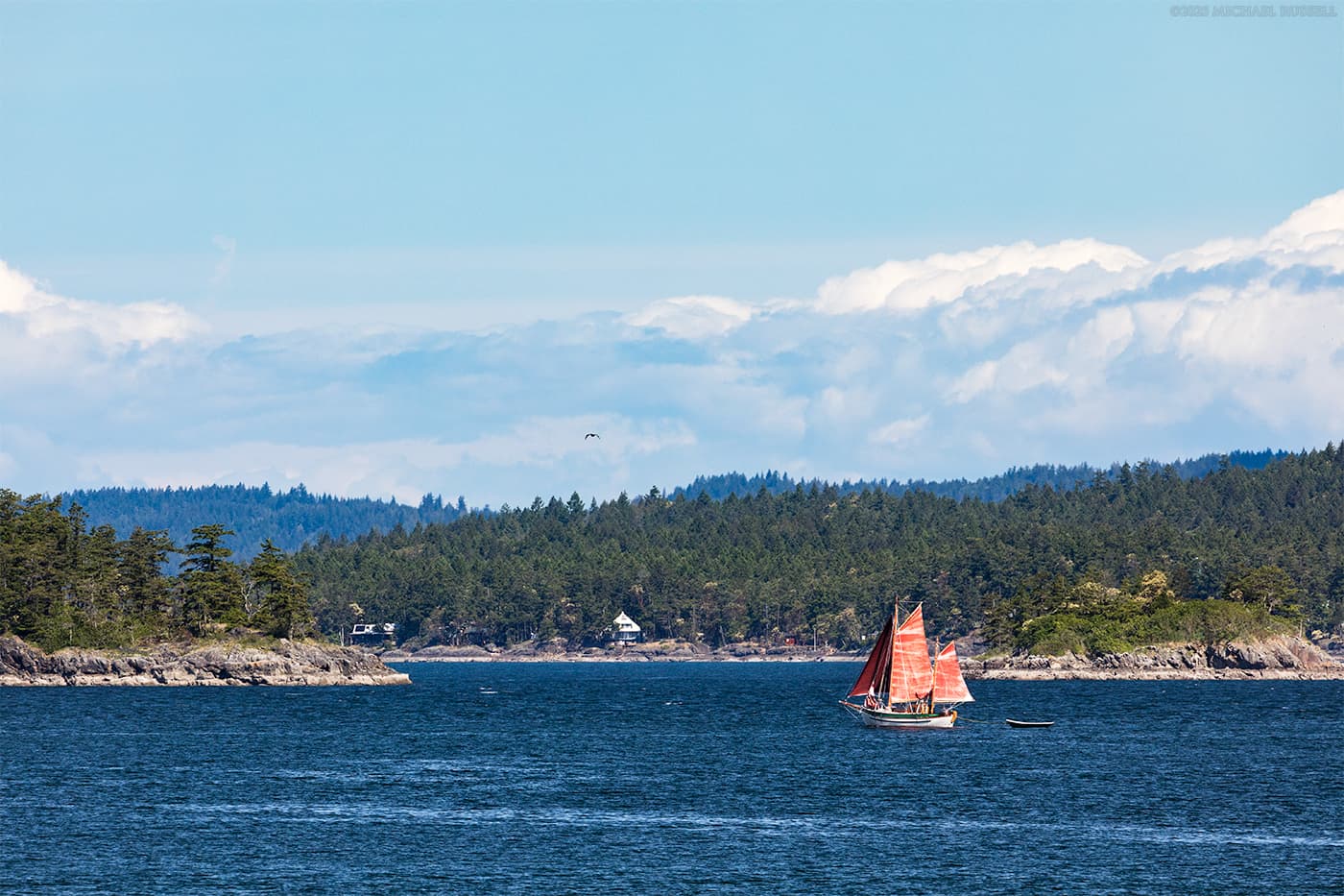 wood sailboat red sails captain passage salt spring island